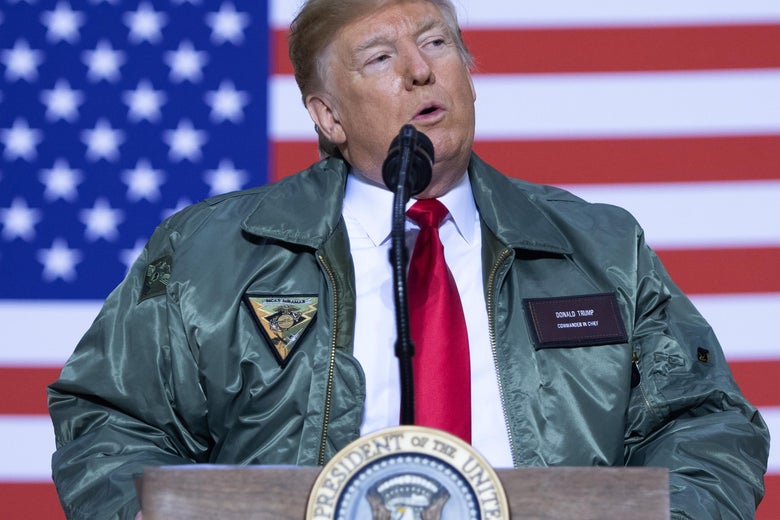 U.S. President Donald Trump speaks to members of the military during an unannounced trip to Al Asad Air Base in Iraq on Dec. 26